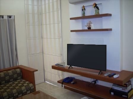 Two-bedroom living room with TV wall